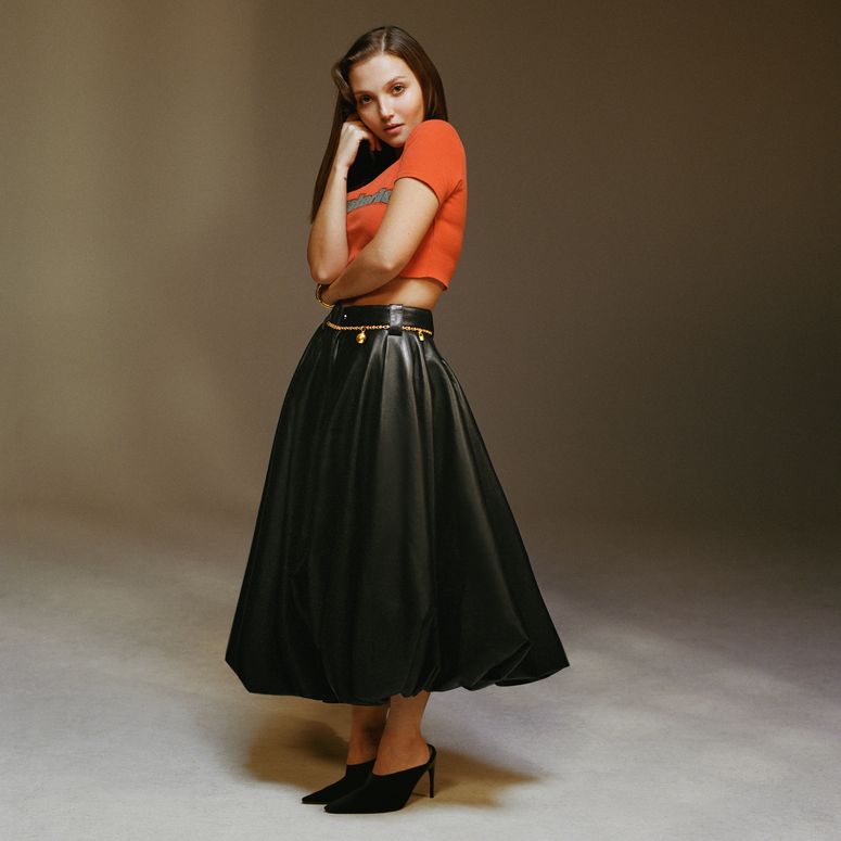 Image may contain: Mia Mckenna-Bruce, Clothing, Dress, Evening Dress, Formal Wear, Skirt, Adult, Person, and Footwear