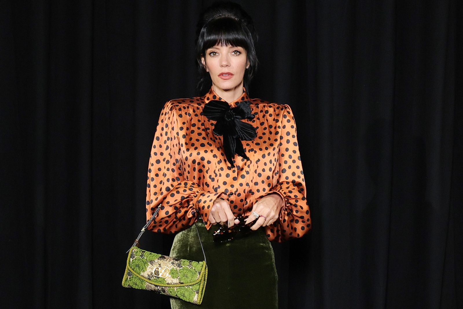 Image may contain: Lily Allen, Accessories, Bag, Handbag, Adult, Person, Purse, Blouse, Clothing, Fashion, Coat, and Face
