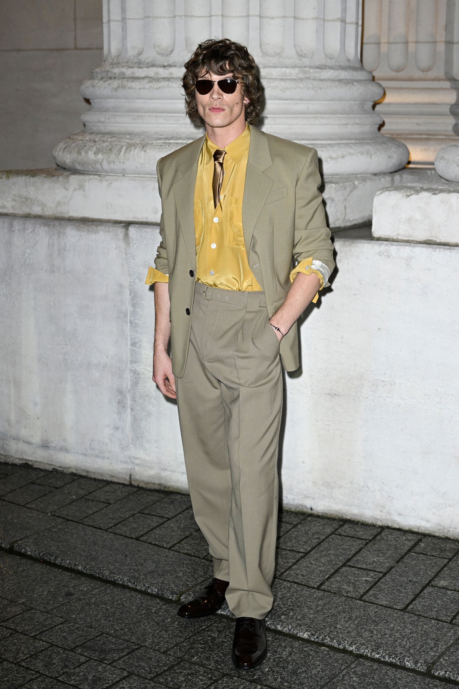 Image may contain Matt McAndrew Clothing Formal Wear Suit Coat Blazer Jacket Person Adult Accessories and Glasses