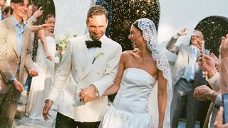 Image may contain Clothing Dress Fashion Formal Wear Gown Wedding Wedding Gown Blazer Coat Jacket Face and Head