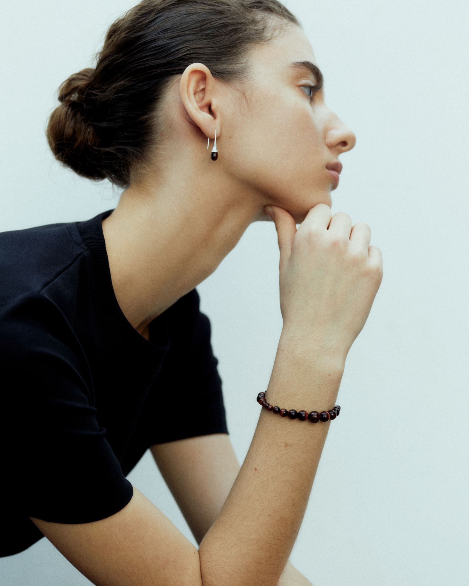 Image may contain Head Person Face Accessories Bracelet Jewelry Adult Earring Body Part and Neck