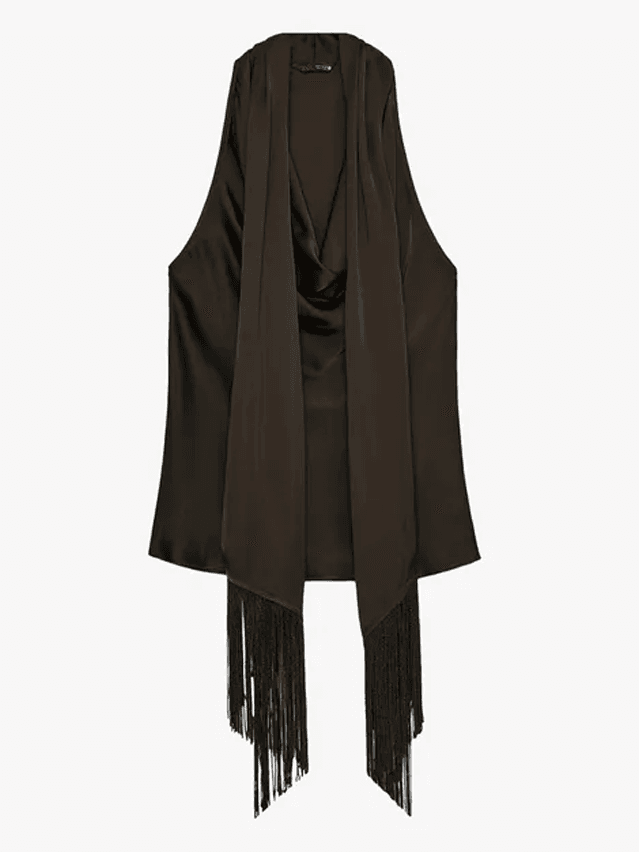 Image may contain: Fashion, Cape, Clothing, Coat, Scarf, and Vest