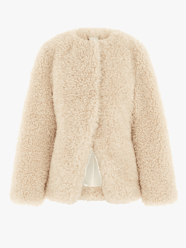 Image may contain Clothing Knitwear Sweater Coat and Jacket